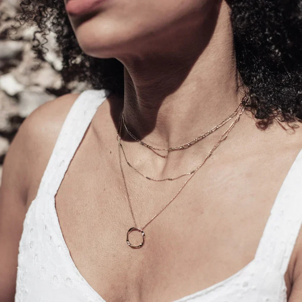 Three-row necklace with open circle