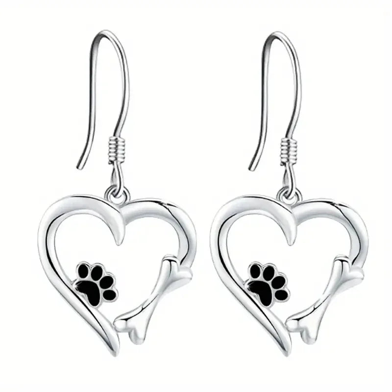 Silver dangling earrings with heart and paw print design