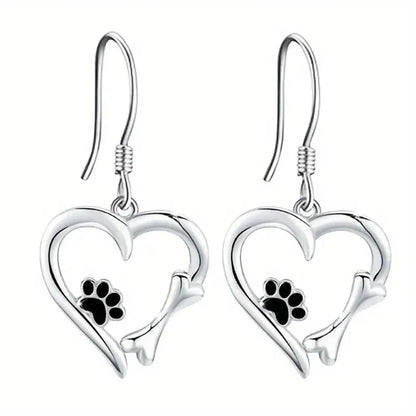 Silver dangling earrings with heart and paw print design